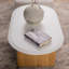 Table basse blanche en bois massif ovale