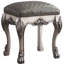 Tabouret de coiffeuse gris et blanc cassé de style vintage pour une chambre élégante, ajoutant une touche sophistiquée à votre espace.