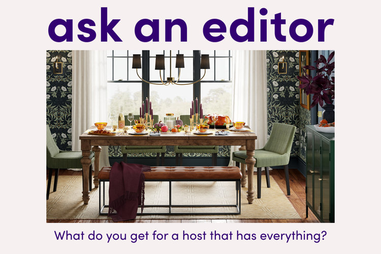 image of a festive fall dinner party with a text overlay saying “ask an editor: what do you get for a host that has everything?”