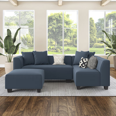 Canapé modulaire modulaire en L avec repose-pieds et coussins décoratifs en bleu marine avec pieds en plastique noir