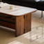 Table basse beige en pierre et bois de noyer