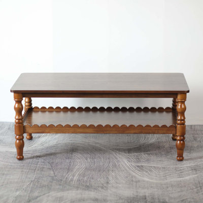 Solid Wood Coffee Table with Two-Tier Storage and Wave-Edge Shelf