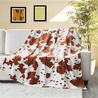 Jeté décoratif à imprimé vache