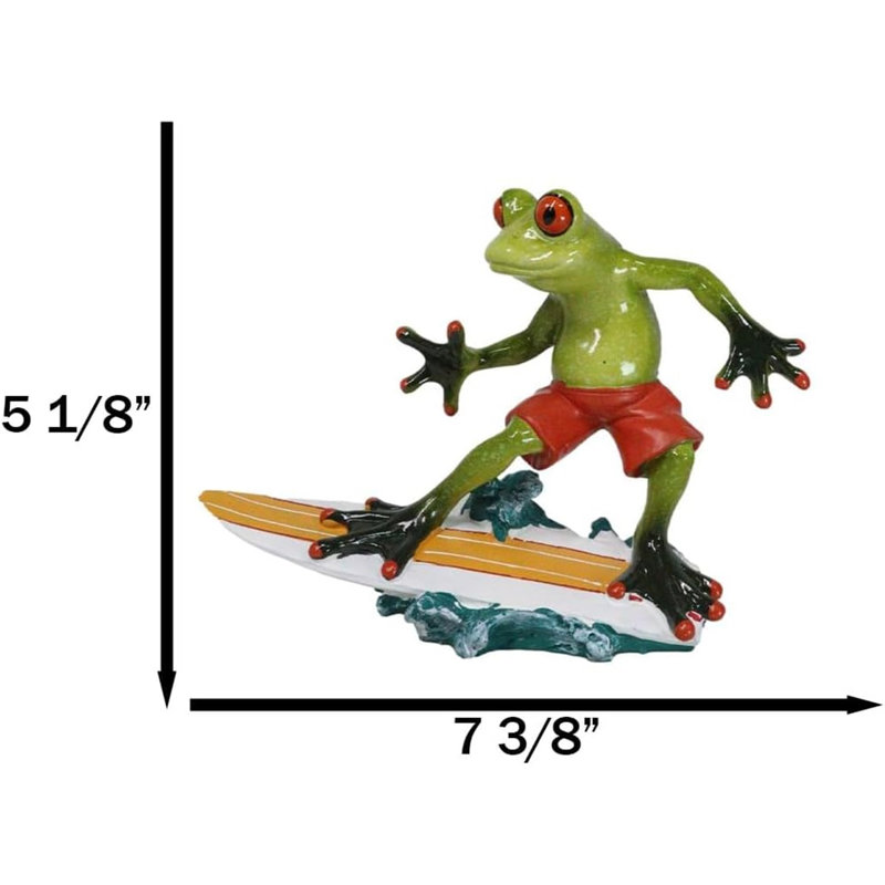 Figurine de surfeur crapaud en short chevauchant des vagues de l'océan avec planche de surf