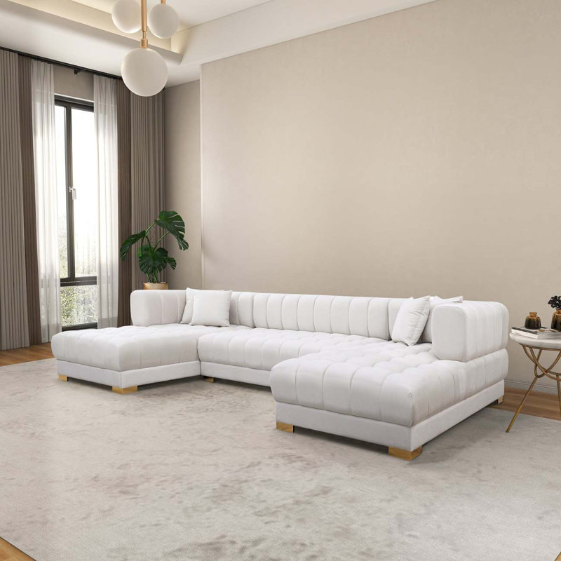 Canapé modulaire capitonné avec repose-pieds