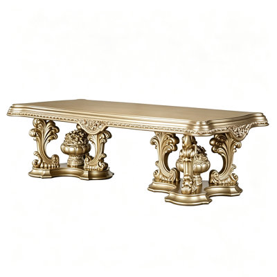 106"Seville Dining Table – carved MDF frame in lustrous gold, double-pedestal base, scrolled feet. Royal opulence at its finest – the commanding centerpiece for any luxury dining room.