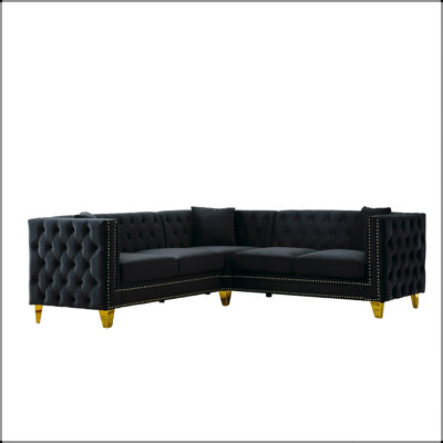 Canapé d'angle en velours luxueux avec coussins moelleux pour un confort optimal dans un salon spacieux et un style moderne et élégant