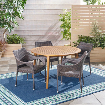 Elifsu 4 - Person Wicker Patio Dining Set with Round Table