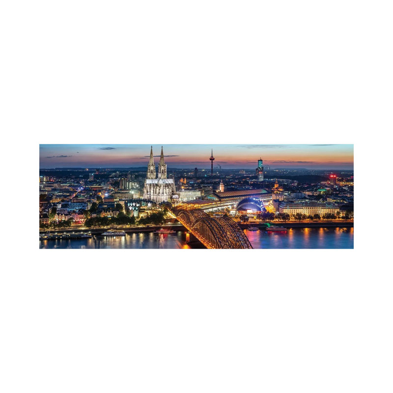 Aerial View Of Cologne With Cologne Cathedral And Hohenzollern Bridge At Night by Jan Becke - Wrapped Canvas Panoramic Print