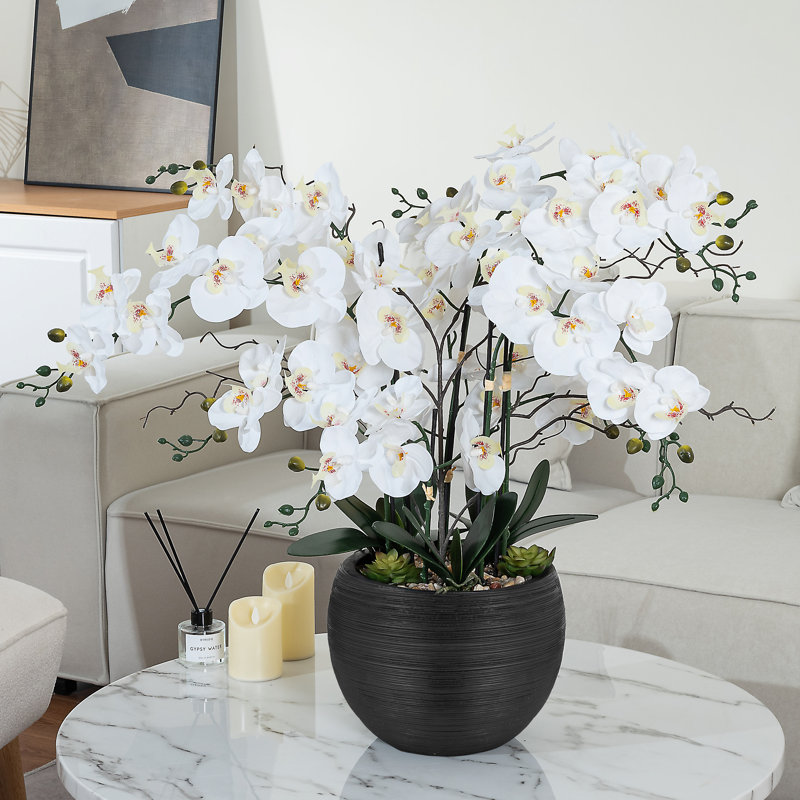 Large White and Green Plastic Orchid Arrangement in Black Pot