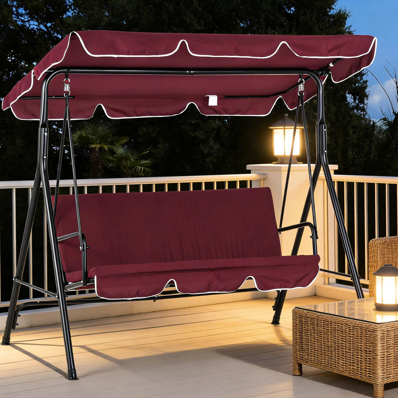Balancelle d'extérieur pour terrasse avec banc trois places, coussins et auvent résistant aux intempéries. Structure robuste en acier, dossier rembourré moelleux.