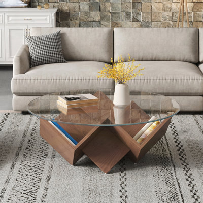 La table basse ronde avec plateau en verre et tablettes de rangement à motif géométrique abstrait Art Deco