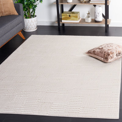 Tapis ivoire / polyester tissé à la machine
