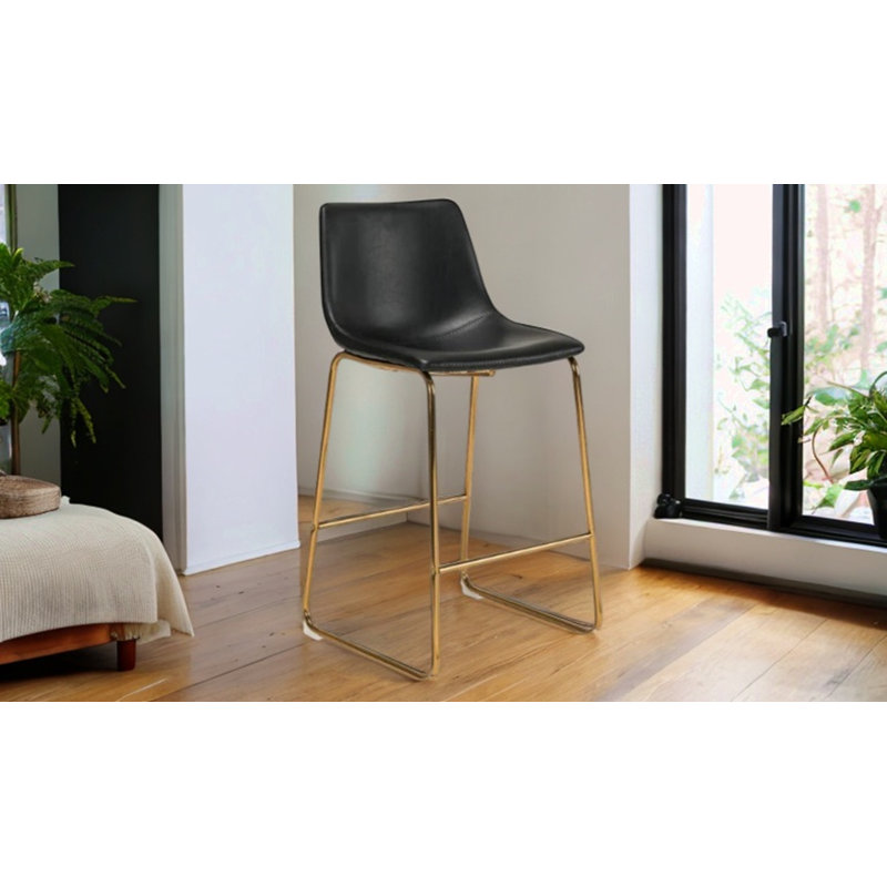 Tabouret de comptoir rembourré Kiryll, Similicuir noir / or, Tabouret de comptoir (siège d'une hauteur de 26 p