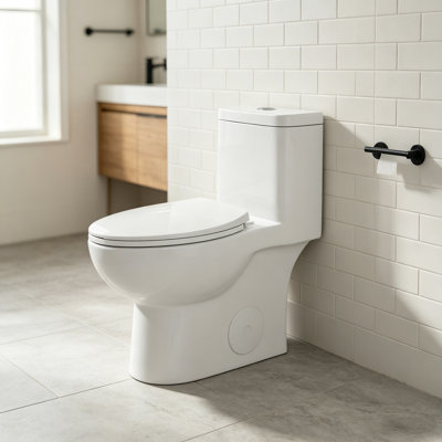 Toilette monobloc de 43 cm (17 po) de hauteur conforme aux normes ADA, avec chasse d'eau double à siphon, abattant à fermeture amortie, cuvette semi-allongée et entraxe de 30,5 cm (12 po) pour une installation facile.