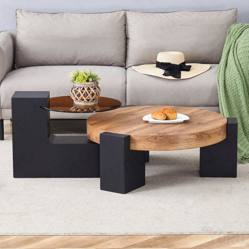 Modern Simple Double-Layer Round Coffee Table - Transparent Brown Glass Top with Black MDF L-Shaped Legs.The detachable design can make the use of space more flexible.
