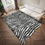 Tapis noir tissé à la machine Reme-780214850