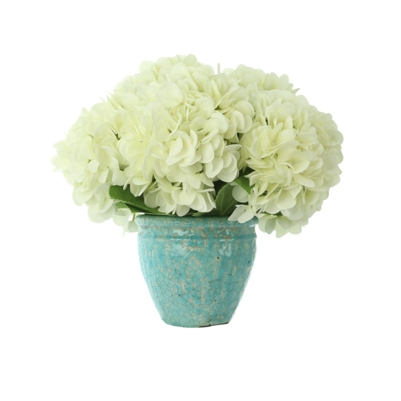 White Hydrangeas in Teal Ceramic Vase