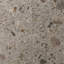 Matte porcelain floor tile in a gray terrazzo stone look with multicolored aggregate patterns.