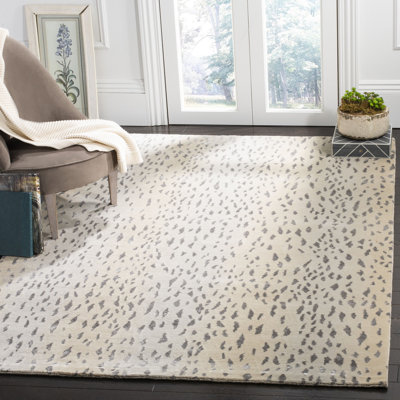 Sowders Tibetan Hand Knotted Wool/Viscose/Cotton Animal Print Rug in Beige/Silver