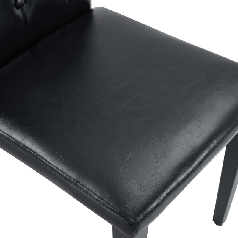 Ensemble de 4 chaises de salle à manger en polyuréthane noir: dossier à boucle ergonomique, hauteur de 35 pouces, pieds en métal noir, un choix discret et luxueux.