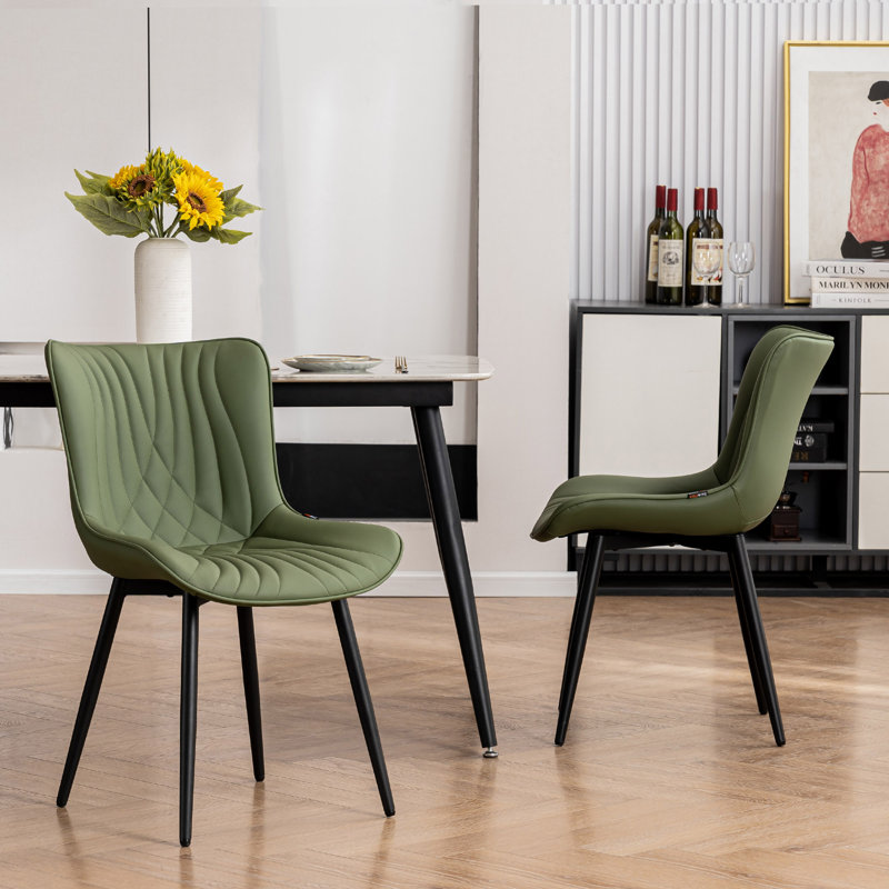 Chaise à oreilles rembourrée en similicuir Jimma avec pieds en fer, Vert