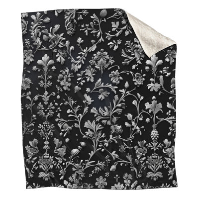 Couvertures florales noires et blanches