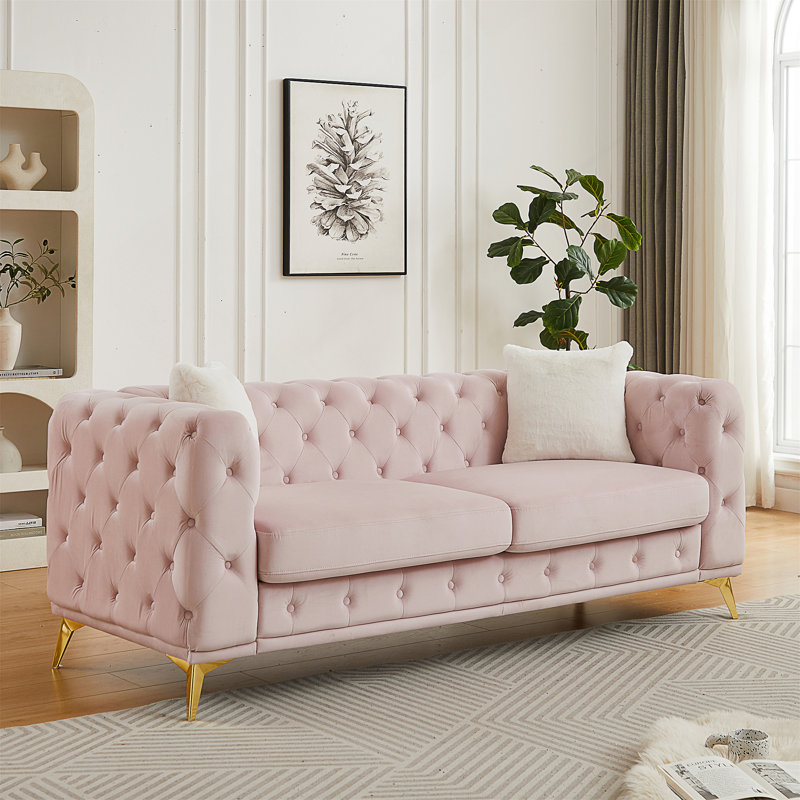 Canapé en velours de style Chesterfield avec détails capitonnés et pieds en métal