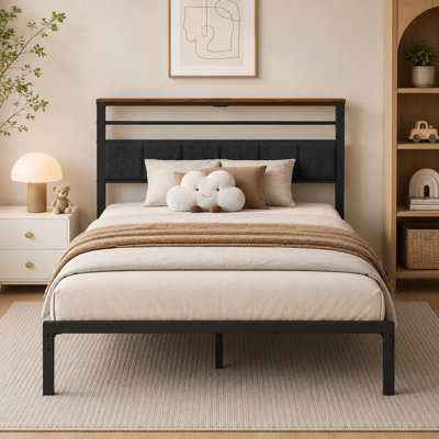 Black upholstered metal single bed frame, with a storage shelf and charging dock at the headboard; sturdy structure eliminates the need for a spring mattress.