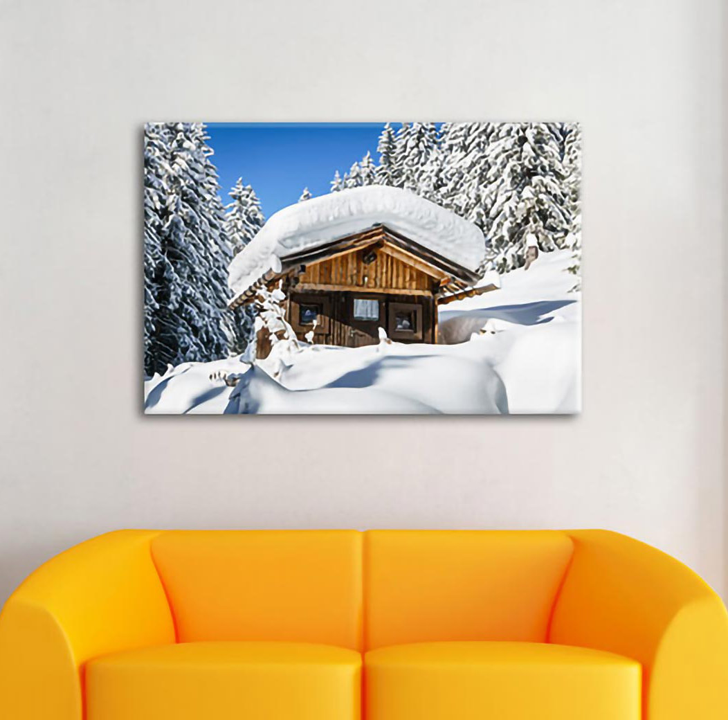 Leinwandbild Snowy Ski Hut in Alpine Forest