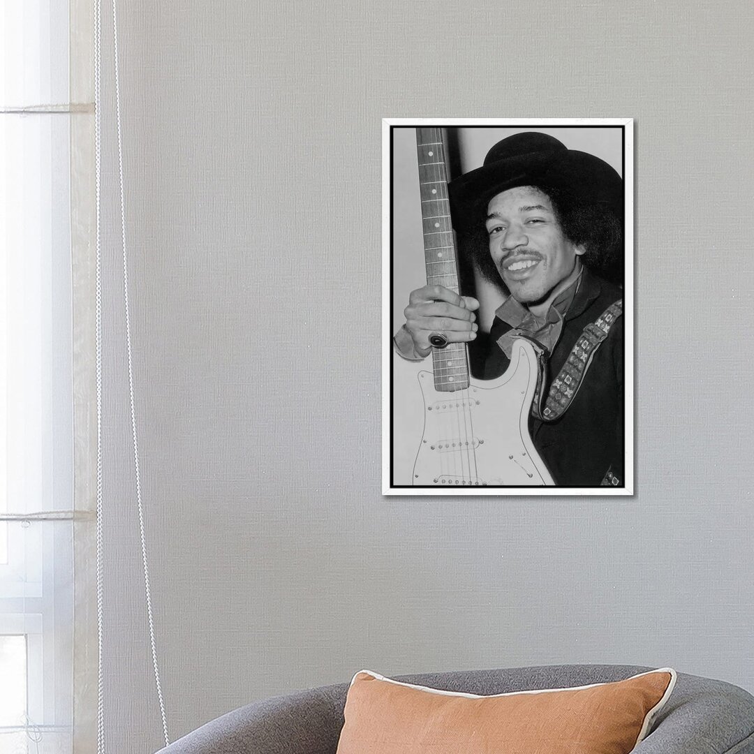 Leinwandbild A Smiling Jimi Hendrix Holding His Guitar von Radio Days