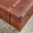 Cantrell Wood Nesting Upholstered Decorative Brown Trunk with Vintage Accents and Studs Set