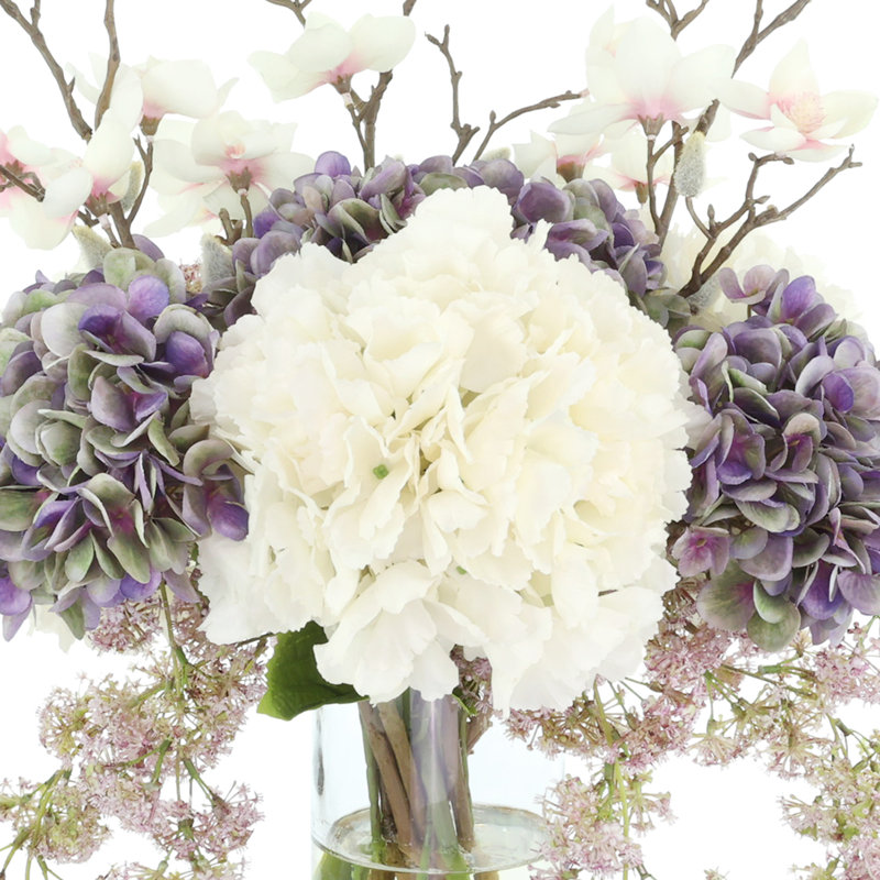 Hydrangea, Laurel and Magnolia Arrangement in a Glass Vase