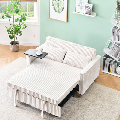 Lit confortable en velours côtelé beige avec table amovible et double port de chargement, créant une ambiance relaxante à la maison, répondant aux exigences du mode de vie moderne.