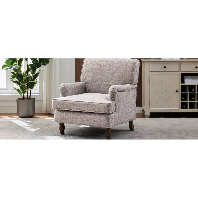 Fauteuil crème rétro avec revêtement en lin et pieds tournés en bois d'hévéa antique, pour lire un magazine dans un livre rembourré confortable