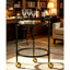 Chariot-bar rond avec tablettes en verre trempé et accents dorés, chariot de service moderne à roulettes