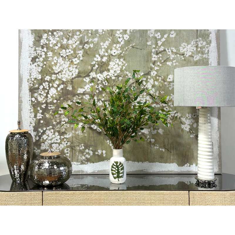 Organic Modern Smilax Arranged In A Ceramic Leaf Vase