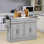 Îlot de cuisine roulant avec rangement, chariot de cuisine portable avec plateau en acier inoxydable, 2 tiroirs, porte-épices, porte-serviettes et armoires, noir