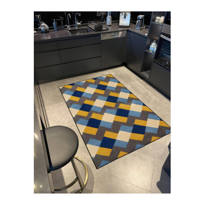Tapis jaune lavable à motif géométrique