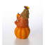 Gnome heureux sur citrouille