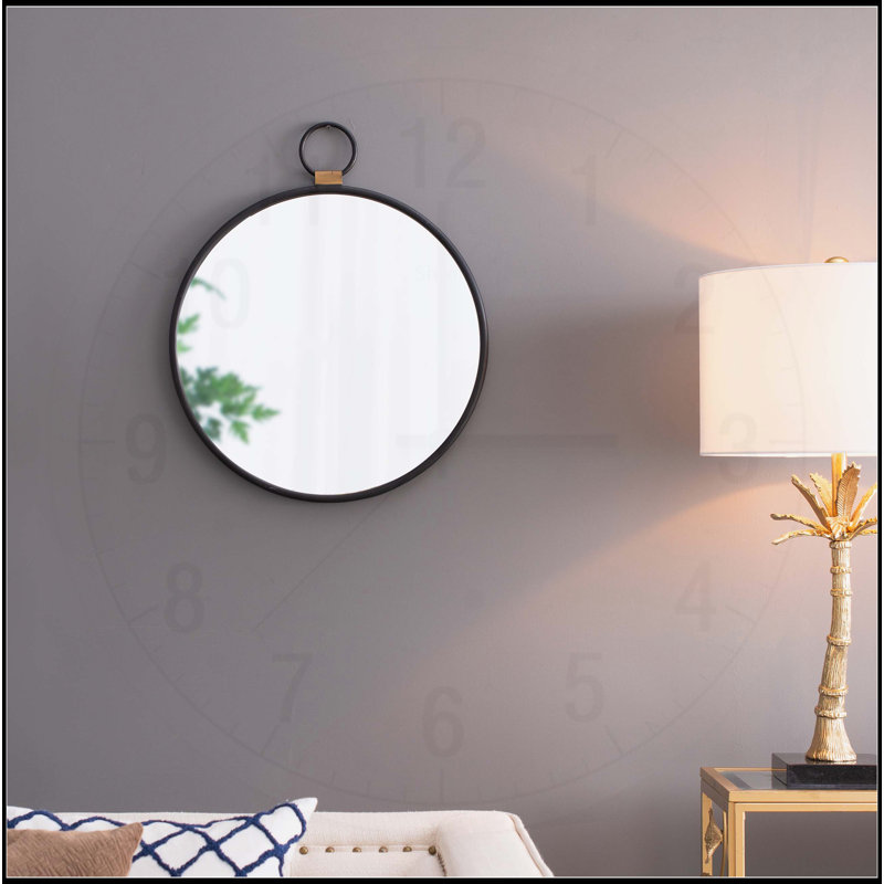 Miroir mural contemporain avec cadre noir élégant, idéal pour rehausser le décor de n'importe quelle pièce et créer une ambiance spacieuse.