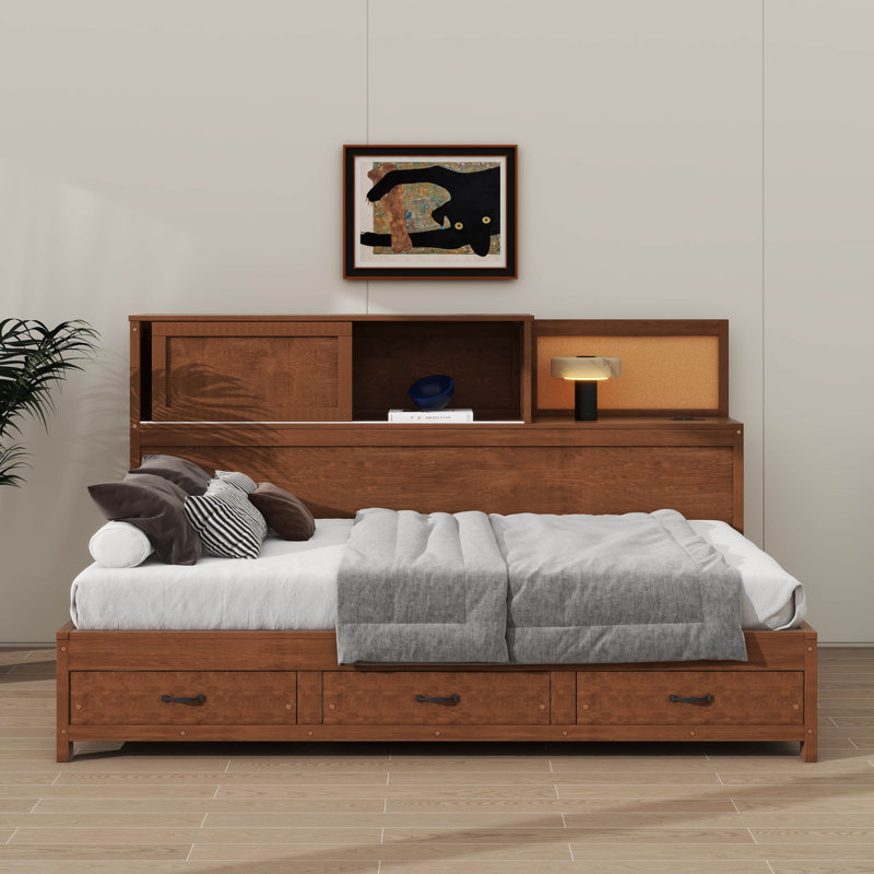 Lit de jour fonctionnel en bois simple avec trois tiroirs de rangement, une tablette supérieure souple et une collection de prises avec ports USB