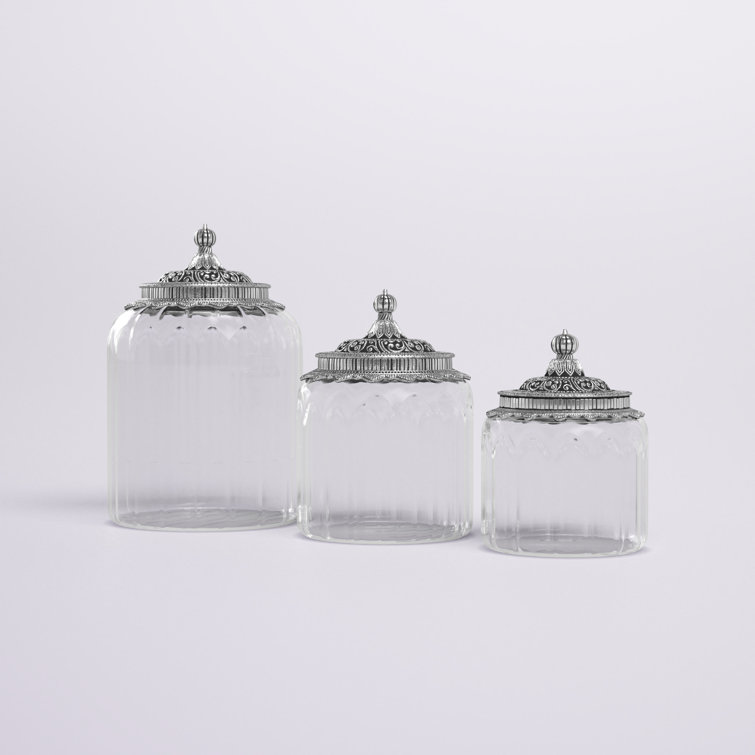 https://assets.wfcdn.com/im/37026573/resize-h755-w755%5Ecompr-r85/2038/203812349/3+Pieces+Clear+Glass+Decorative+Jars+with+Engraved+Silver+Lids+6%22%2C+7%22%2C+9%22+H.jpg