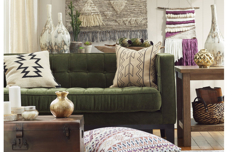Living room with green couch and burlap fabric throw pillows