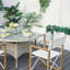Ensemble repas pour 4 personnes avec chaises pliantes en bois et table en verre tressé