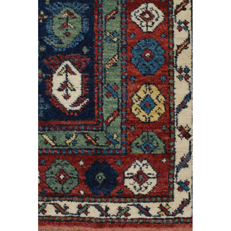 Seychour Wool Oriental Area Rug in Green/Red