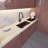 StoneCore 30-inch single bowl kitchen sink in Sienna stone with Accessories