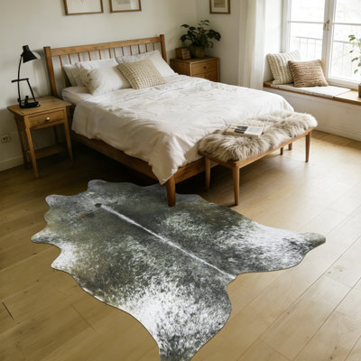 Faux leather animal print area rug for indoor spaces, suitable for commercial and residential settings.