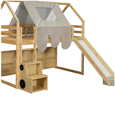 Wooden cabin frame with a tented loft bed