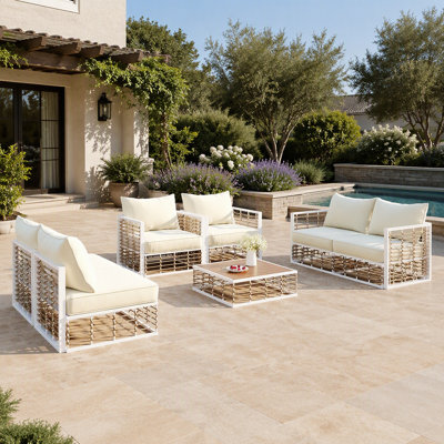 Ensemble de canapé d'angle de patio moderne et minimaliste en métal sept pièces avec coussins épais et table basse